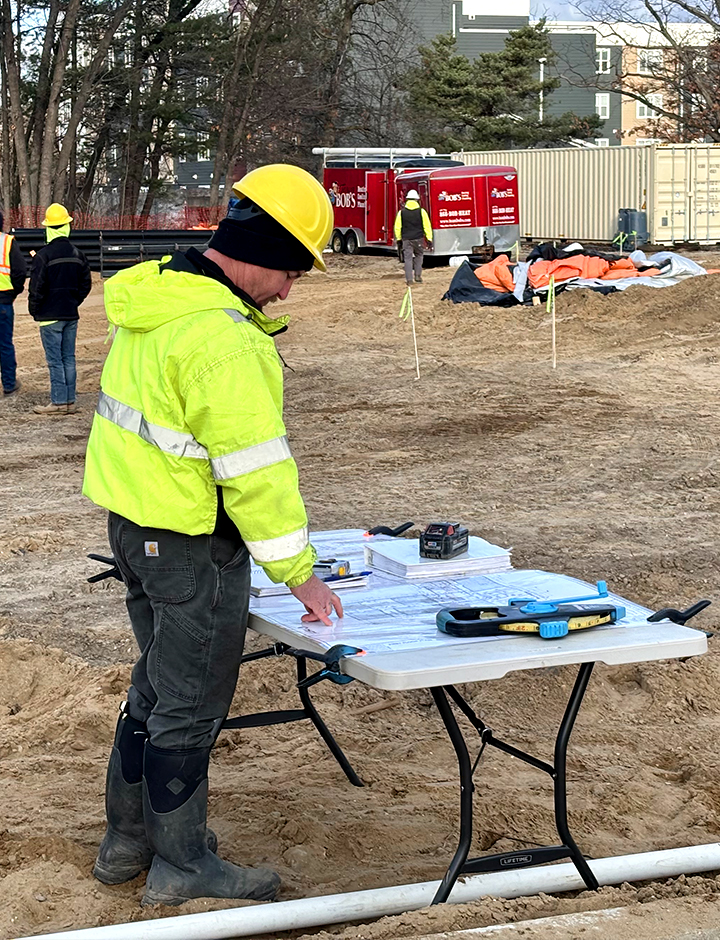 Underground commercial plumbing being surveyed.